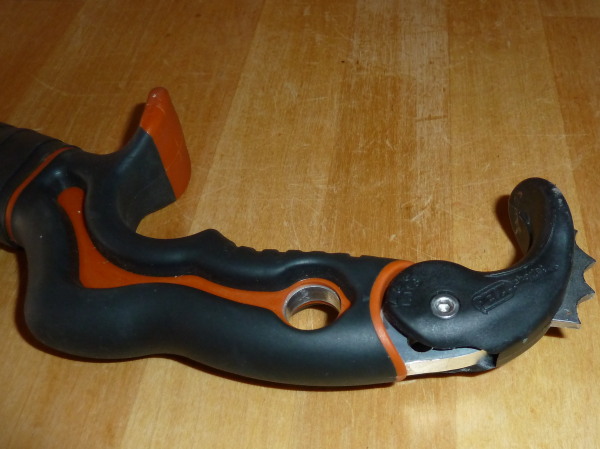 Adjustable grip, awkard lanyard hole, plus mystery hole!